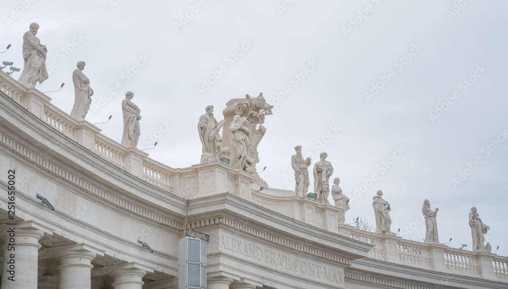 Vatican City, Rome, Italy - February 23, 2019: Part of the architectural structure on the square of the Vatican, Rome. Angels on the roof.