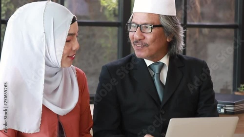 Senior business Arabic people meeting Muslim woman partner with tablet at office