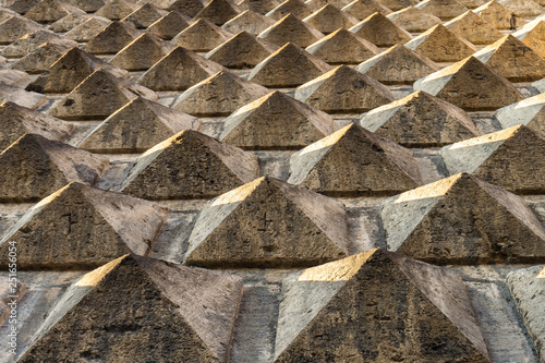 Quadro em tela Pyramids 3d relief in stone brick work on the facade of building close up