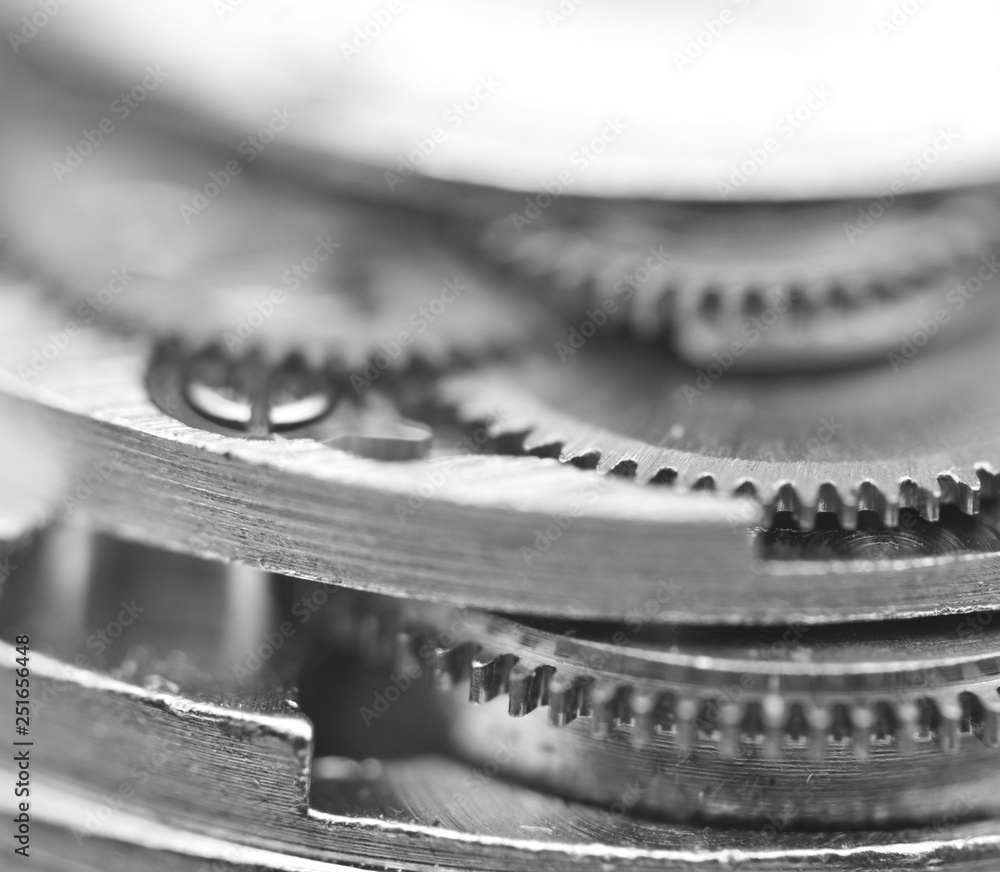 Black and white photography. Background with metal gear wheels. Macro. Black and white photography. Background with metal gear wheels. Macro.