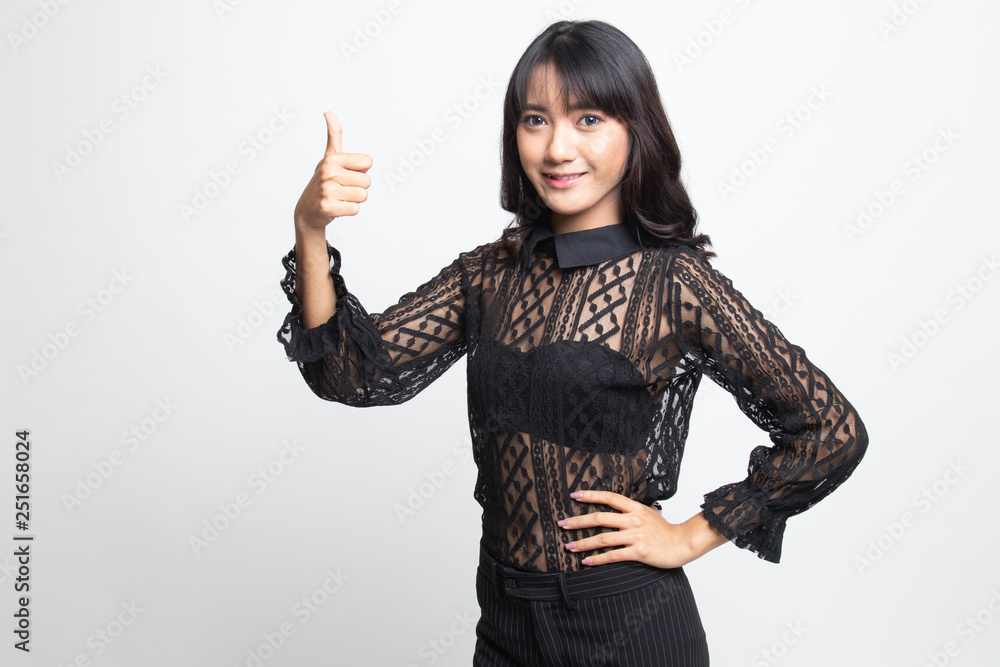Young Asian woman show thumbs up. Young Asian woman show thumbs up.