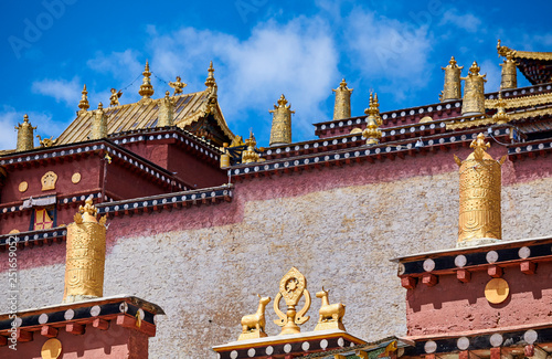 Architecture details of the Songzanlin Monastery, also known as the Ganden Sumtseling Monastery, the largest Tibetan Buddhist monastery in Yunnan, China. photo