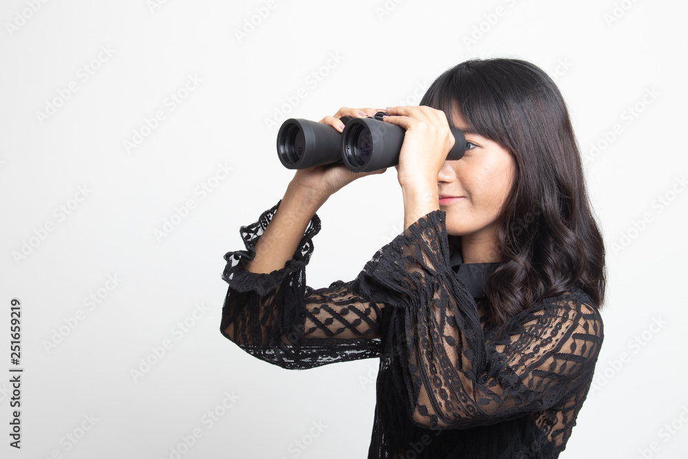 Young Asian woman with binoculars. Young Asian woman with binoculars.