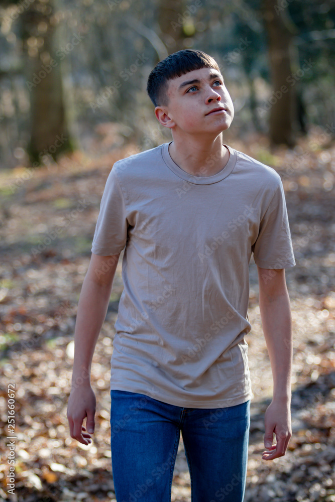 Teenage boy outside on a bright Spring day Teenage boy outside on a bright Spring day