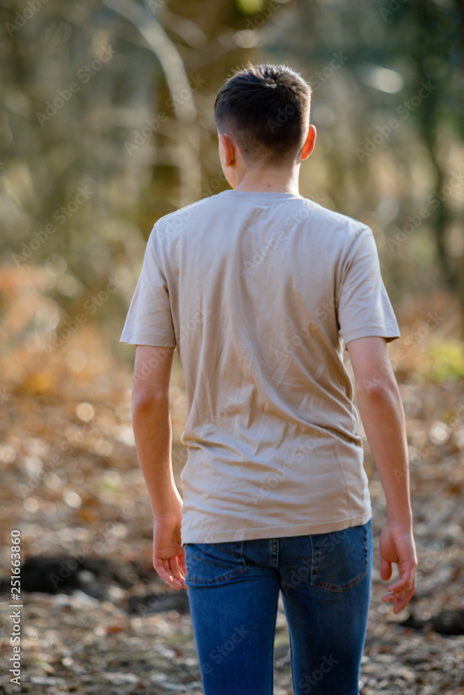 Teenage boy outside on a bright Spring day Teenage boy outside on a bright Spring day