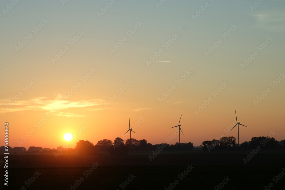 beautiful sunset and wind turbine