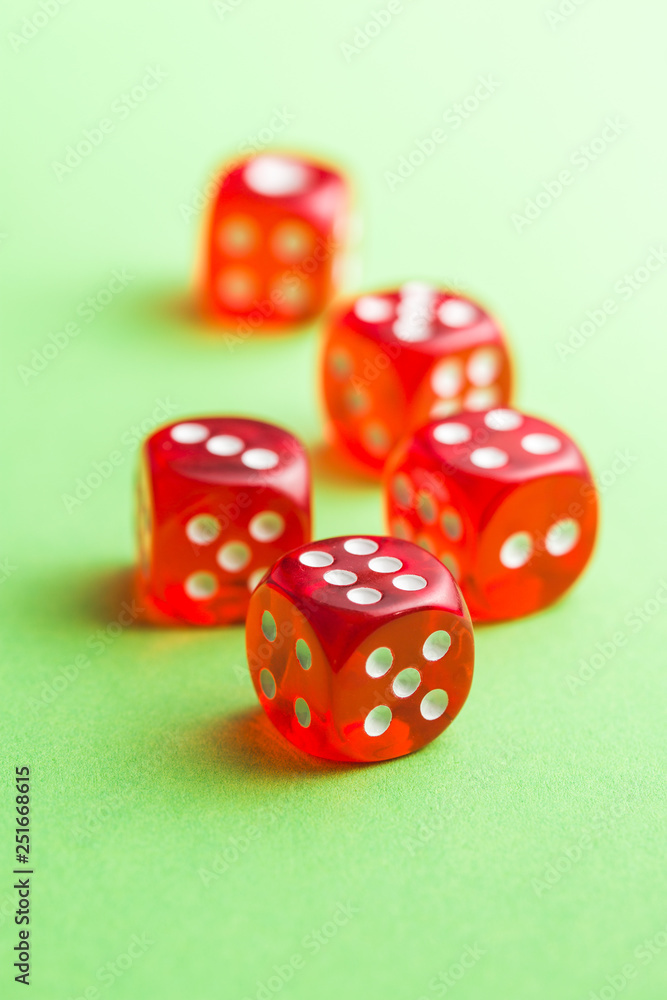 Red glass playing dices. Red glass playing dices.