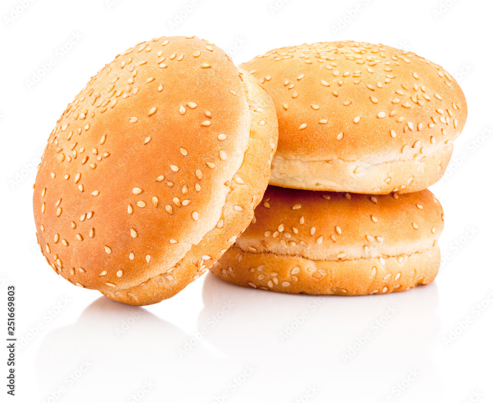 Three hamburger buns with sesame isolated on a white background Three hamburger buns with sesame isolated on a white background