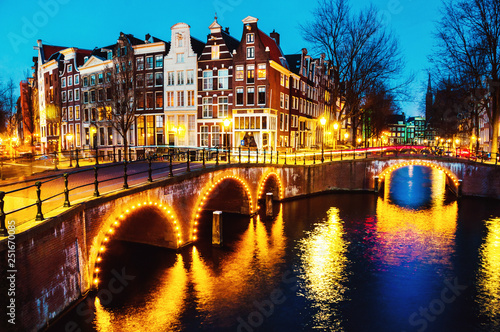 Fototapeta Night view of canals and bridges in Amsterdam, Netherlands