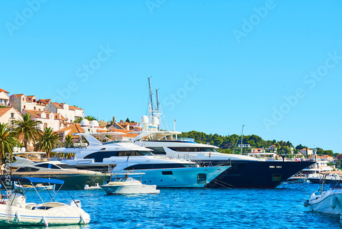 Luxury yachts, ships and boats anchored in the harbor of Hvar, Croatia