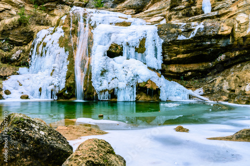 Frosty waterfall in the winter. photo