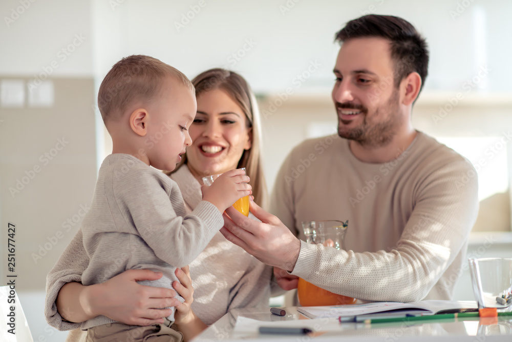 Family with child making juice at home Family with child making juice at home