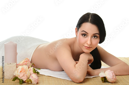 Spa beautiful Woman on a bamboo rug