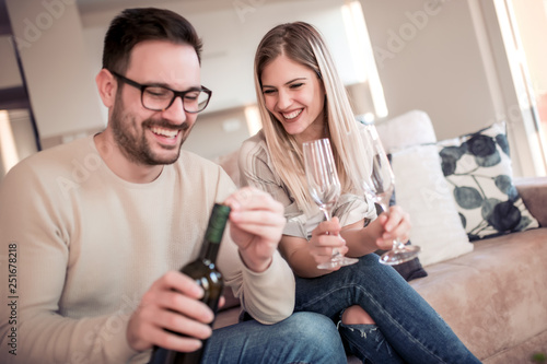 Couple drink wine at home