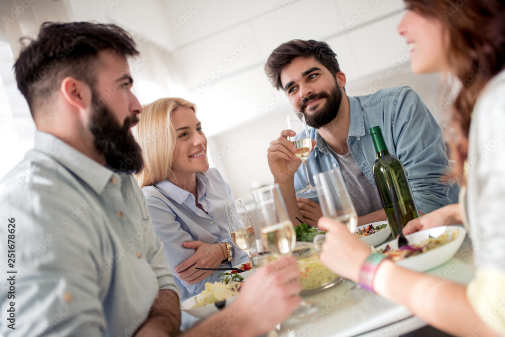 Friends having lunch together at home