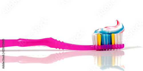 Toothpaste and toothbrush on a white background .