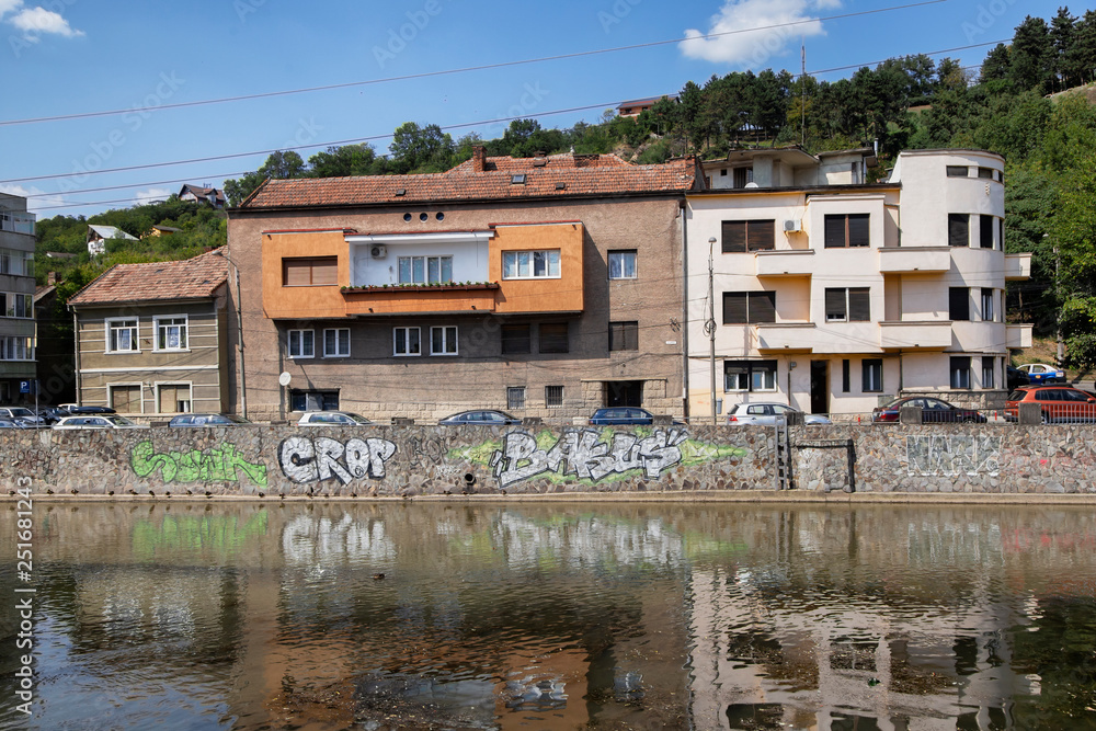  Buildings mirrored in the Somes River in  Cluj-Napoca.