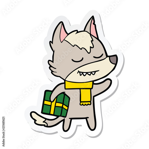 sticker of a friendly cartoon wolf carrying christmas present
