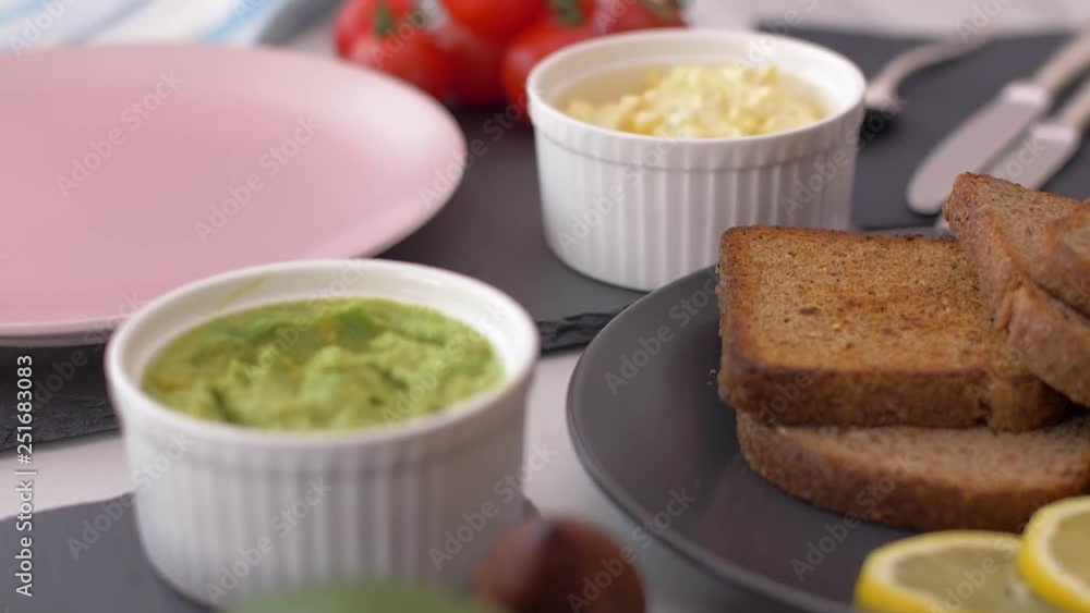 Healthy breakfast with avocado sandwich and egg salad