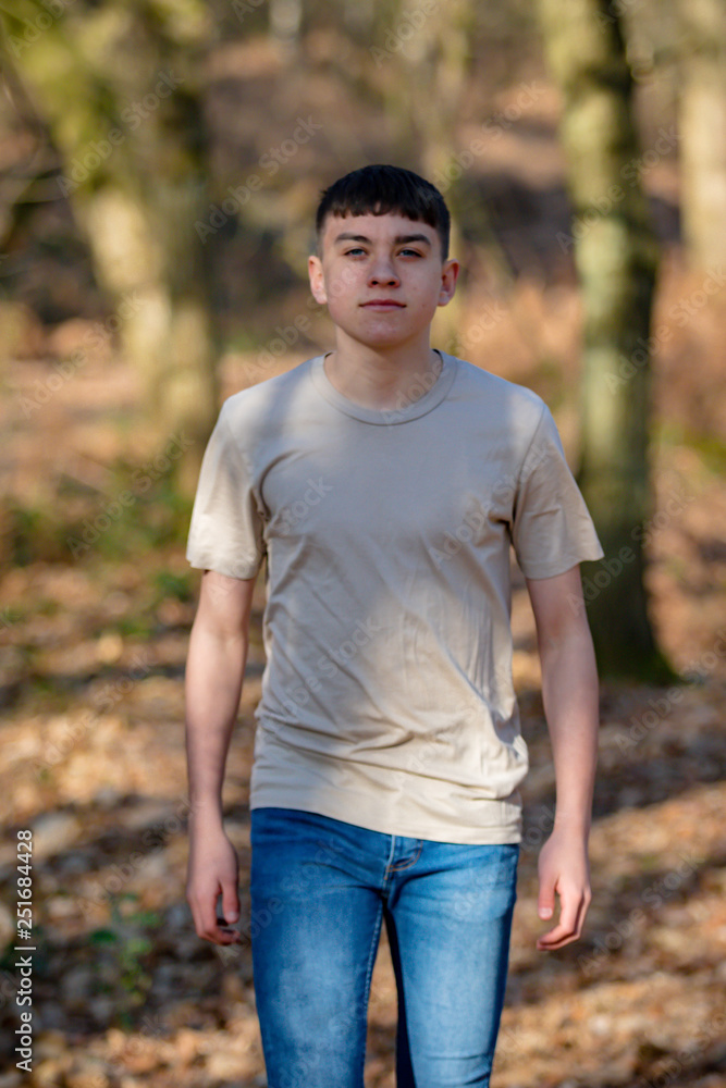Teenage boy outside on a bright Spring day Teenage boy outside on a bright Spring day