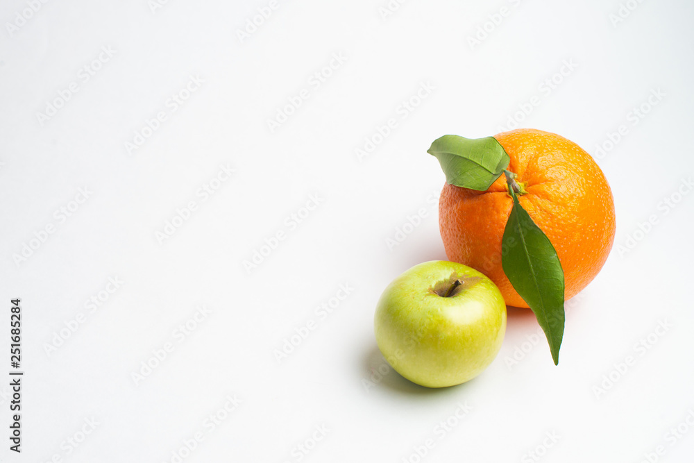 Apples and orange fresh from the garden isolated white background Apples and orange fresh from the garden isolated white background