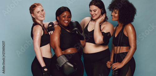 Women of different race and body size in sportswear