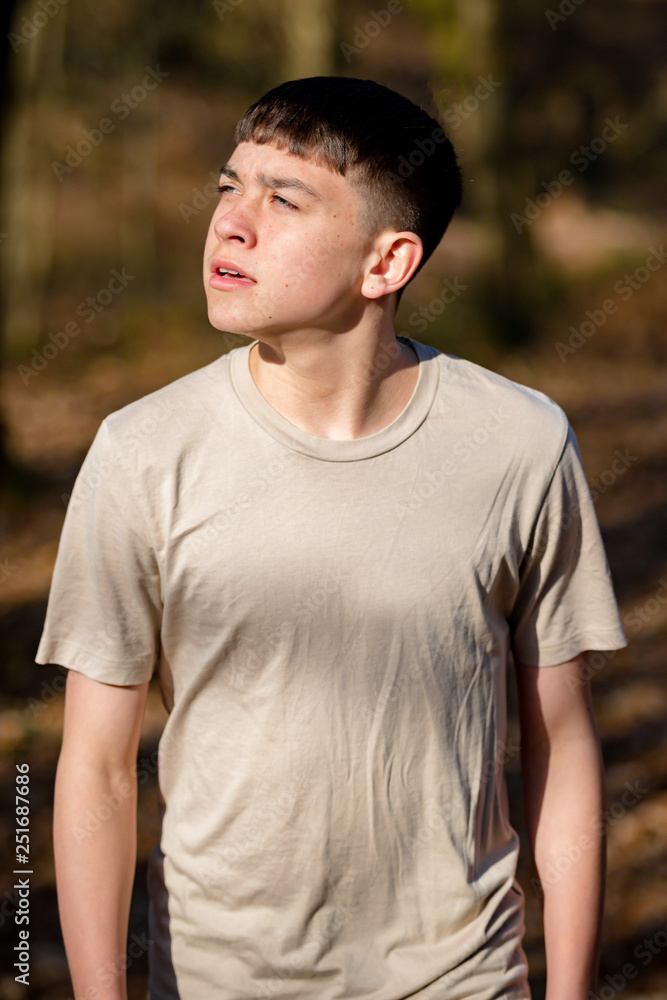 Teenage boy outside on a bright Spring day Teenage boy outside on a bright Spring day