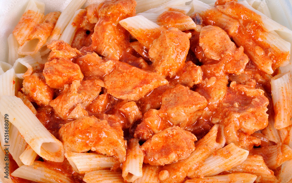 goulash with meat pieces and pasta close up. goulash with meat pieces and pasta close up.