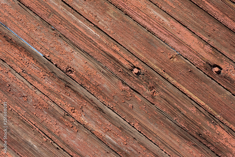 Wooden fence with old terracotta peeling paint. For design, banner and layout Wooden fence with old terracotta peeling paint. For design, banner and layout
