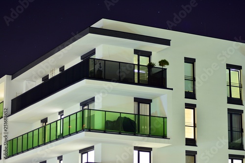 Exterior of apartment building at night  © Grand Warszawski