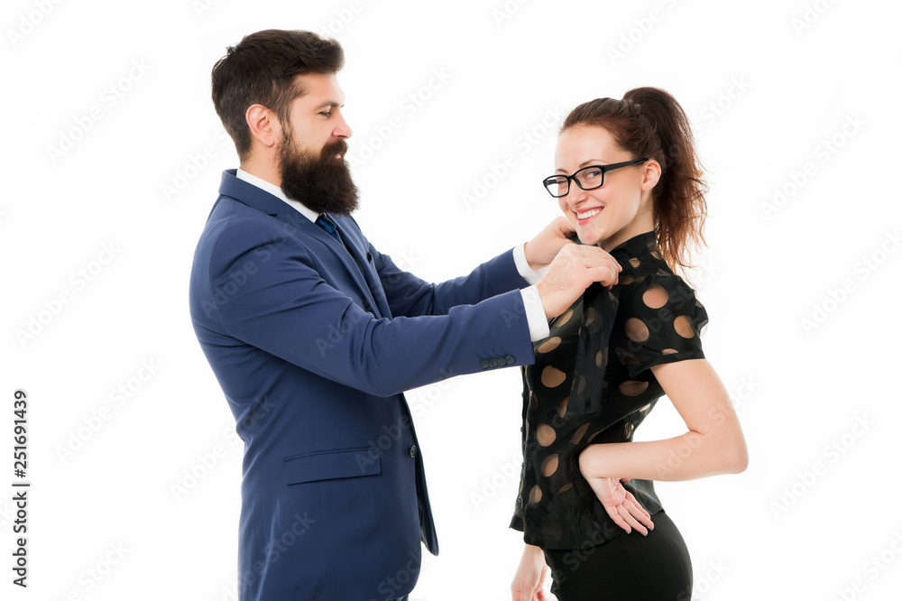 Last detail. Business relations. Help each other look perfect. Business partners man and woman adjust outfit before business conference or meeting. Boss and attractive lady assistant white background Last detail. Business relations. Help each other look perfect. Business partners man and woman adjust outfit before business conference or meeting. Boss and attractive lady assistant white background
