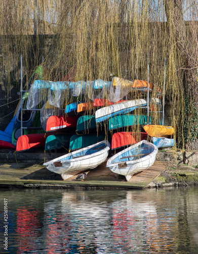 Canoes by the riverbank