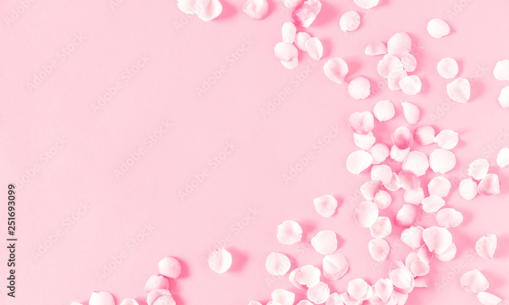 Flowers composition romantic. Pink background and pink petals of rose flowers. Wedding. Birthday. Happy woman's day. Mothers Day. Valentine's Day. Flat lay, top view, copy space