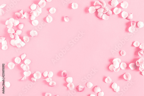 Fototapeta Naklejka Na Ścianę i Meble -  Flowers composition romantic. Pink background and pink petals of rose flowers. Wedding. Birthday. Happy woman's day. Mothers Day. Valentine's Day. Flat lay, top view, copy space