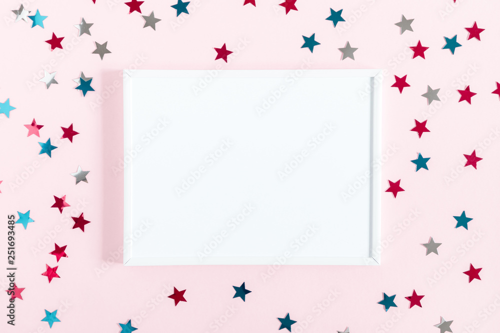 Festive pink background. Shining stars, photo frame on light pink pastel background. Birthday holiday concept. Flat lay, top view, copy space Festive pink background. Shining stars, photo frame on light pink pastel background. Birthday holiday concept. Flat lay, top view, copy space