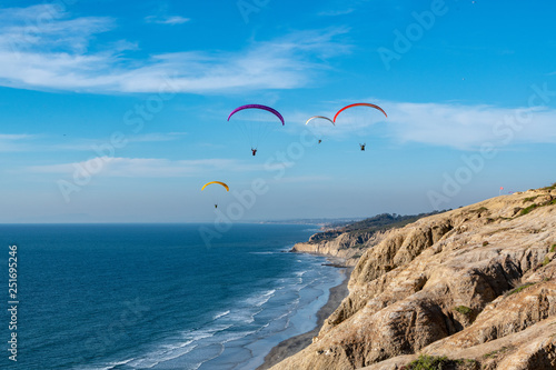 paragliders over the sea © David Levin