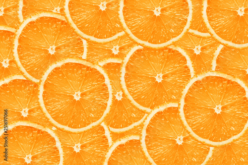 Orange fruit slices pattern design background.