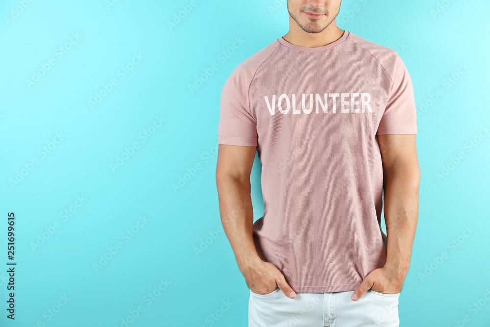 Young man in t-shirt on color background. Mockup for design Young man in t-shirt on color background. Mockup for design