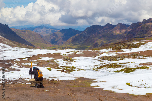 defeated man, panoramic view,Vinicunca, Seven Colors Mountain,Seven Colors Mountain,Trekking,Cusco, Perú.