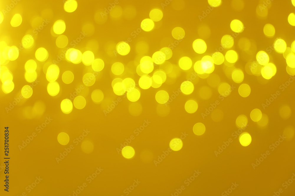 Blurred view of shiny gold lights. Bokeh effect Blurred view of shiny gold lights. Bokeh effect