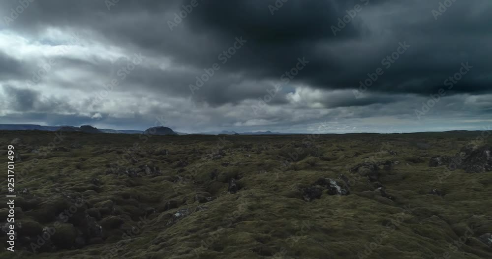 Flying over lava field moss under dark stormy sky drone aerial Iceland.mov Flying over lava field moss under dark stormy sky drone aerial Iceland.mov
