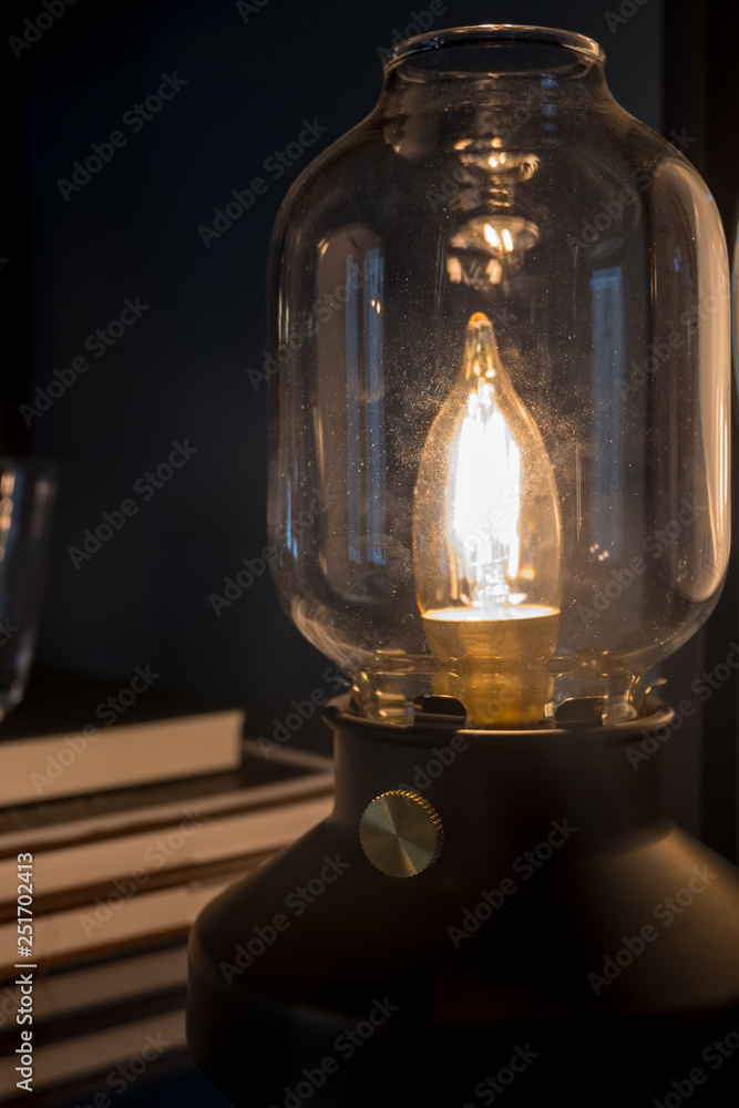 Close up modern lamp glowing in the dark Close up modern lamp glowing in the dark