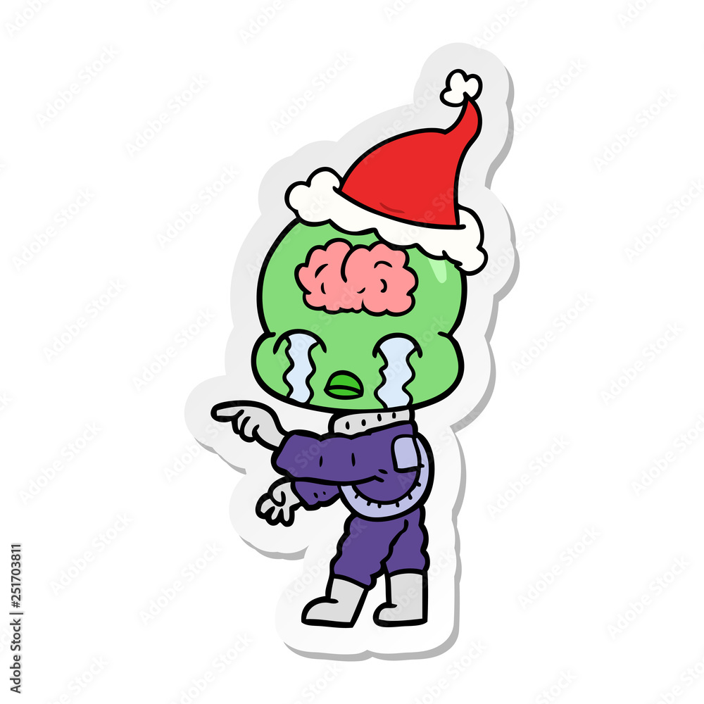 sticker cartoon of a big brain alien crying and pointing wearing santa hat sticker cartoon of a big brain alien crying and pointing wearing santa hat