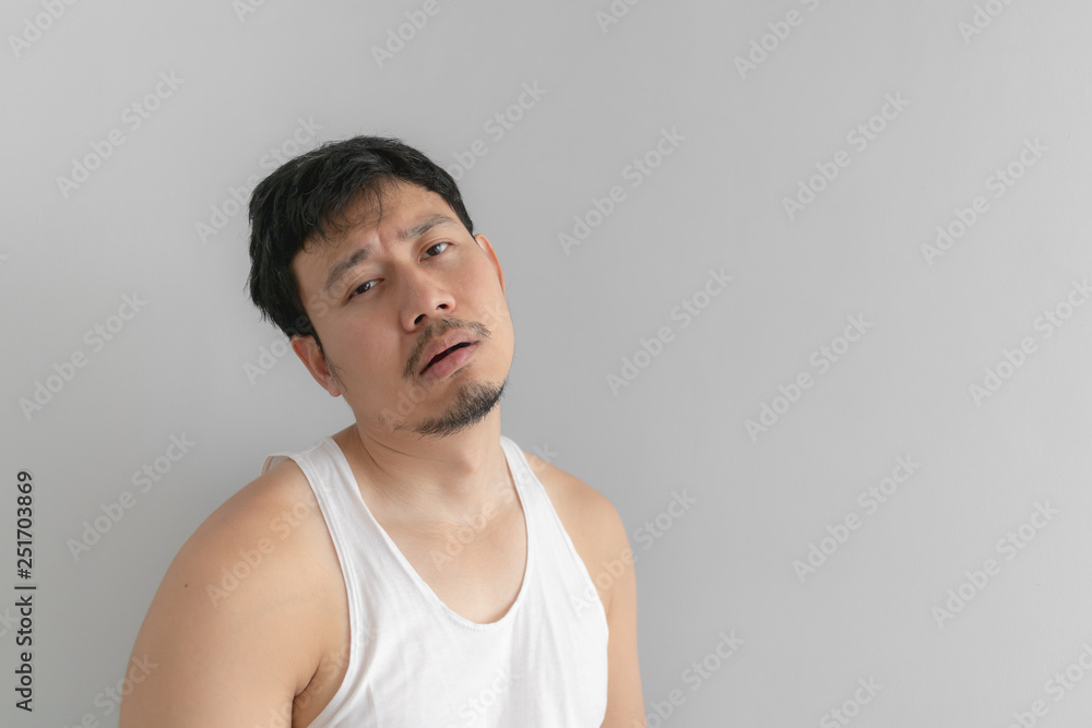 Lazy and messy man in white tank top. Concept of poor and problem. Lazy and messy man in white tank top. Concept of poor and problem.