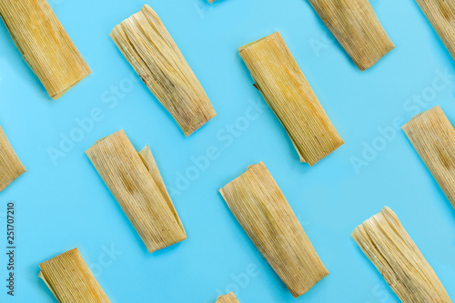 Colorful pattern with tamales on blue background. Top View. Copy Space. Pop art design.