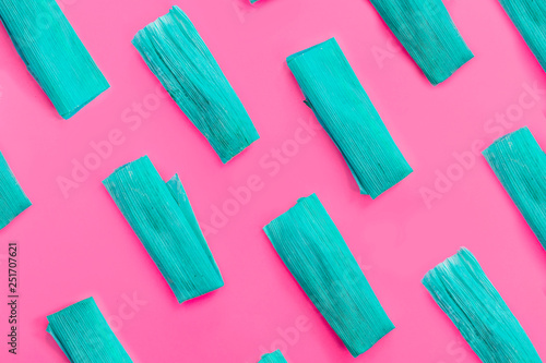 Colorful pattern with blue tamales on pink background. Top View. Copy Space. Pop art design.