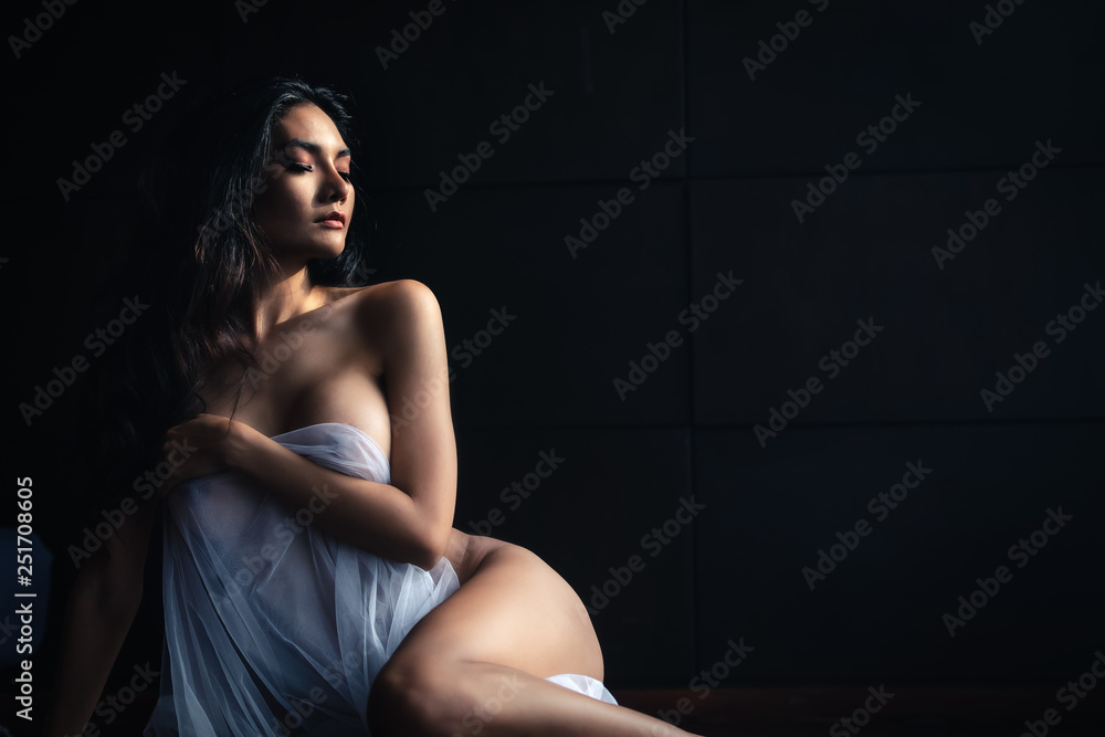 emotion of art work concept lady sexy body slim posing thai model on dark  background Stock Photo | Adobe Stock