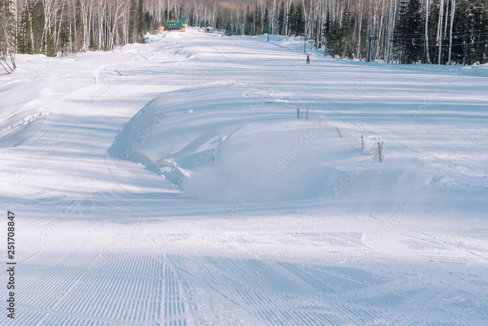 Obraz premium Ski resort. Snow slope. Active lifestyle. Ride from a snowy mountain.