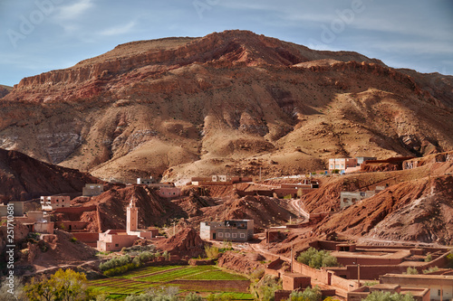 Red rocks and mosque in a rural town of Dades du Gorges canyon in Morocco dessert, Africa