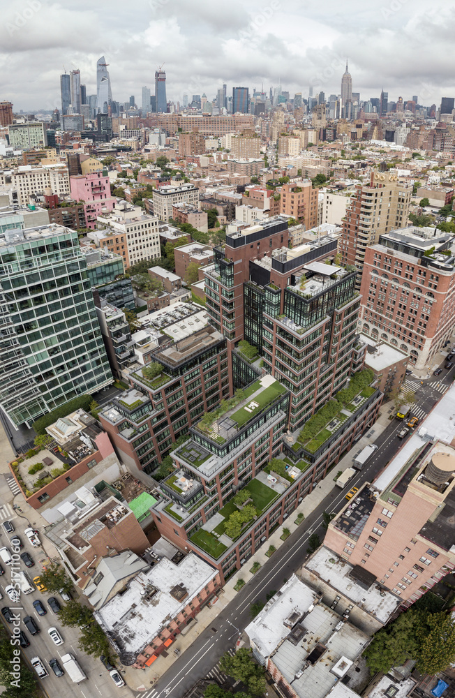 Aerial view of a modern apartment building with Manhattan skyline